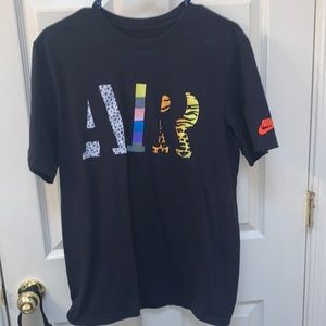 Nike T-Shirt. Medium. Multi color, multi design.